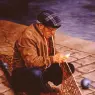 Massey_Fisherman_Mending_His_Net